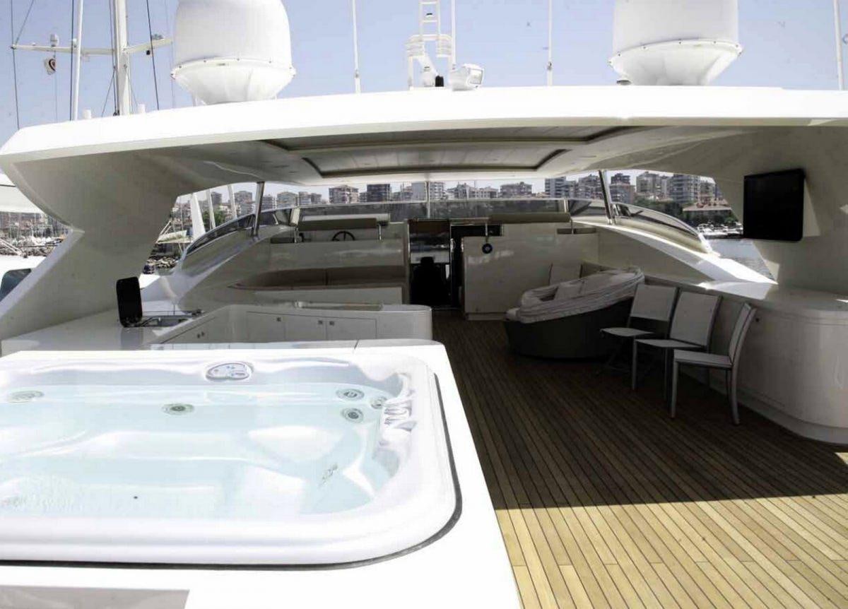 a large white room with a large white table and chairs aboard PANFELISS Yacht for Charter