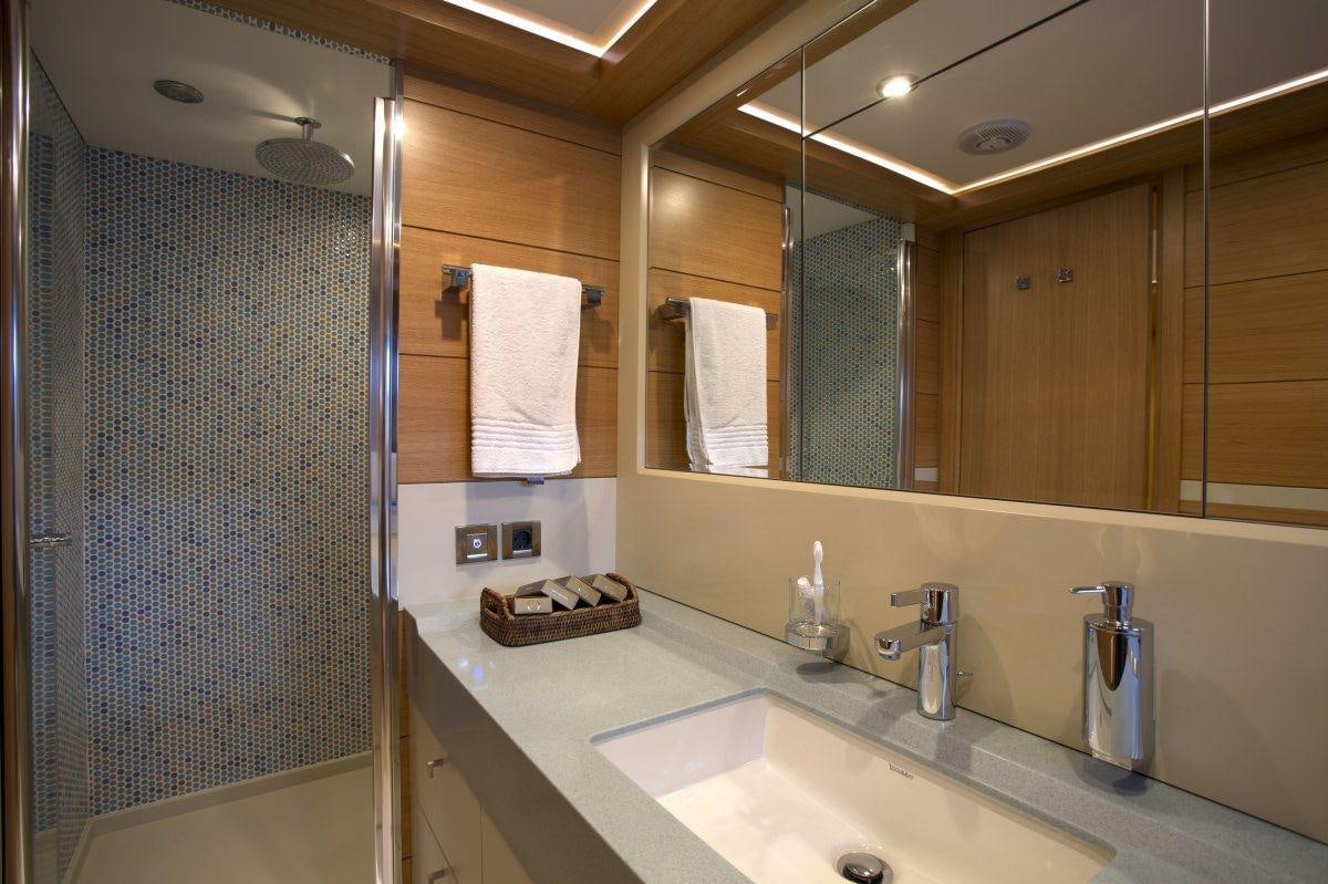 a bathroom with a sink and a shower aboard PANFELISS Yacht for Charter