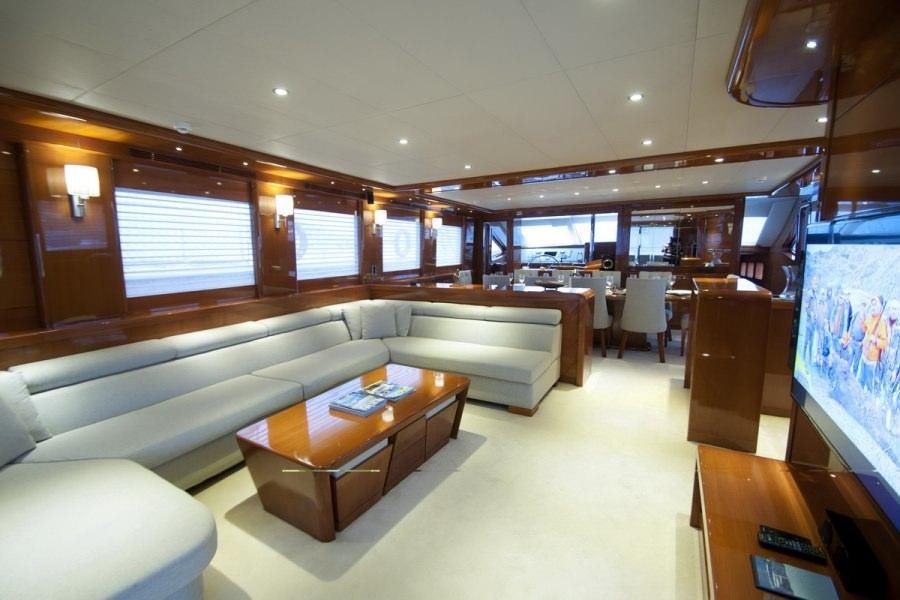 a room with a couch and a table aboard GULMARIA Yacht for Charter