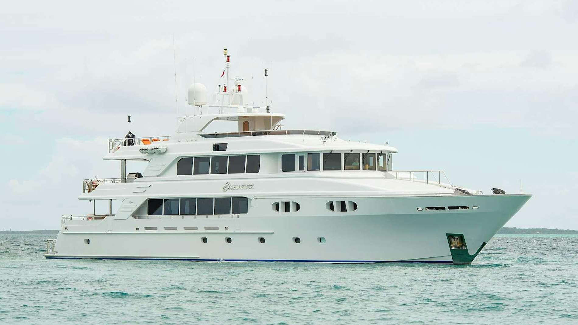 a large white boat in the water aboard EXCELLENCE Yacht for Charter