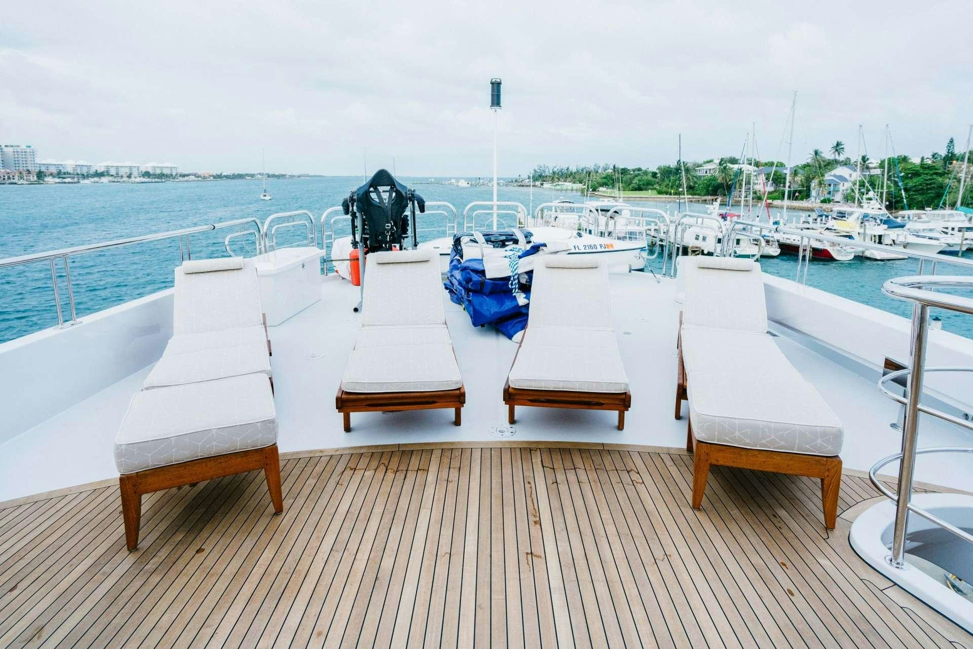 a group of chairs on a dock aboard EXCELLENCE Yacht for Charter