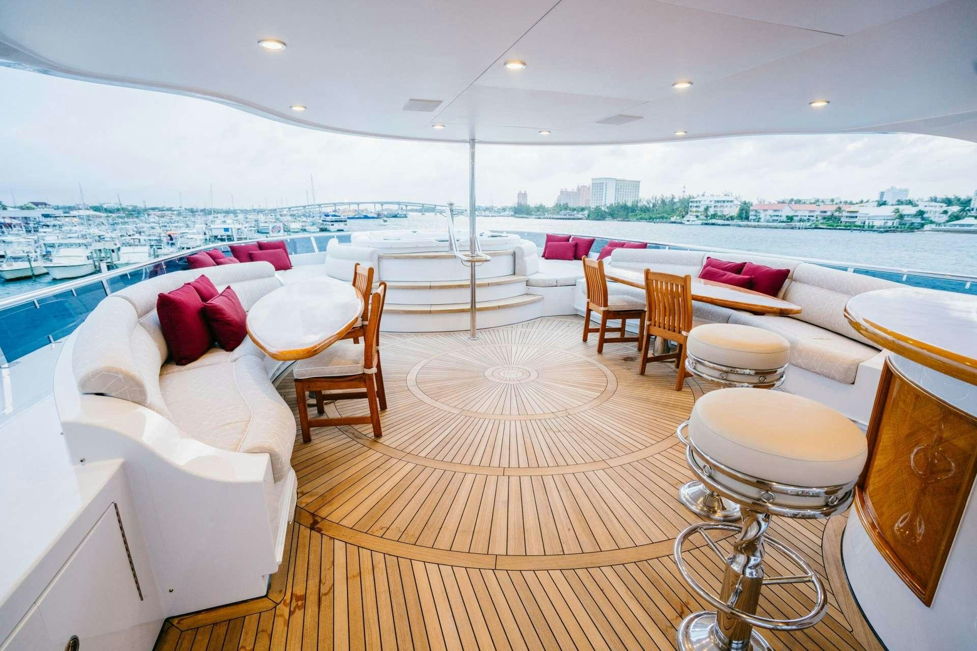 a room with a view of the ocean and a city aboard EXCELLENCE Yacht for Charter