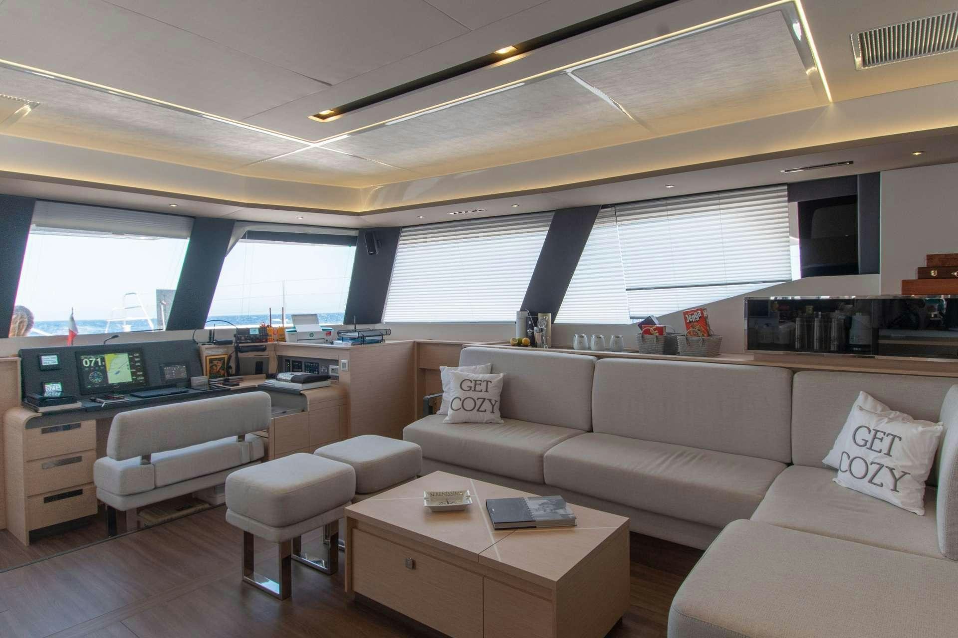 a living room with a couch and a table aboard SERENISSIMA Yacht for Charter
