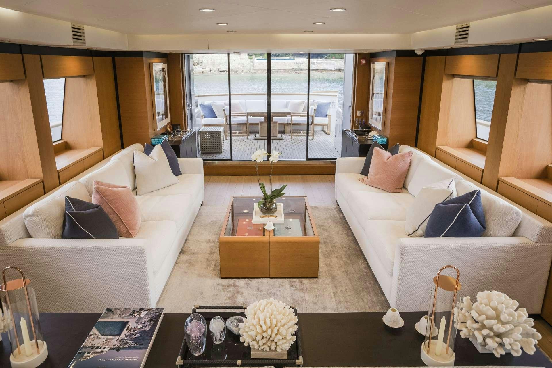 a living room with a couch and a coffee table aboard MOHASUWEI Yacht for Charter