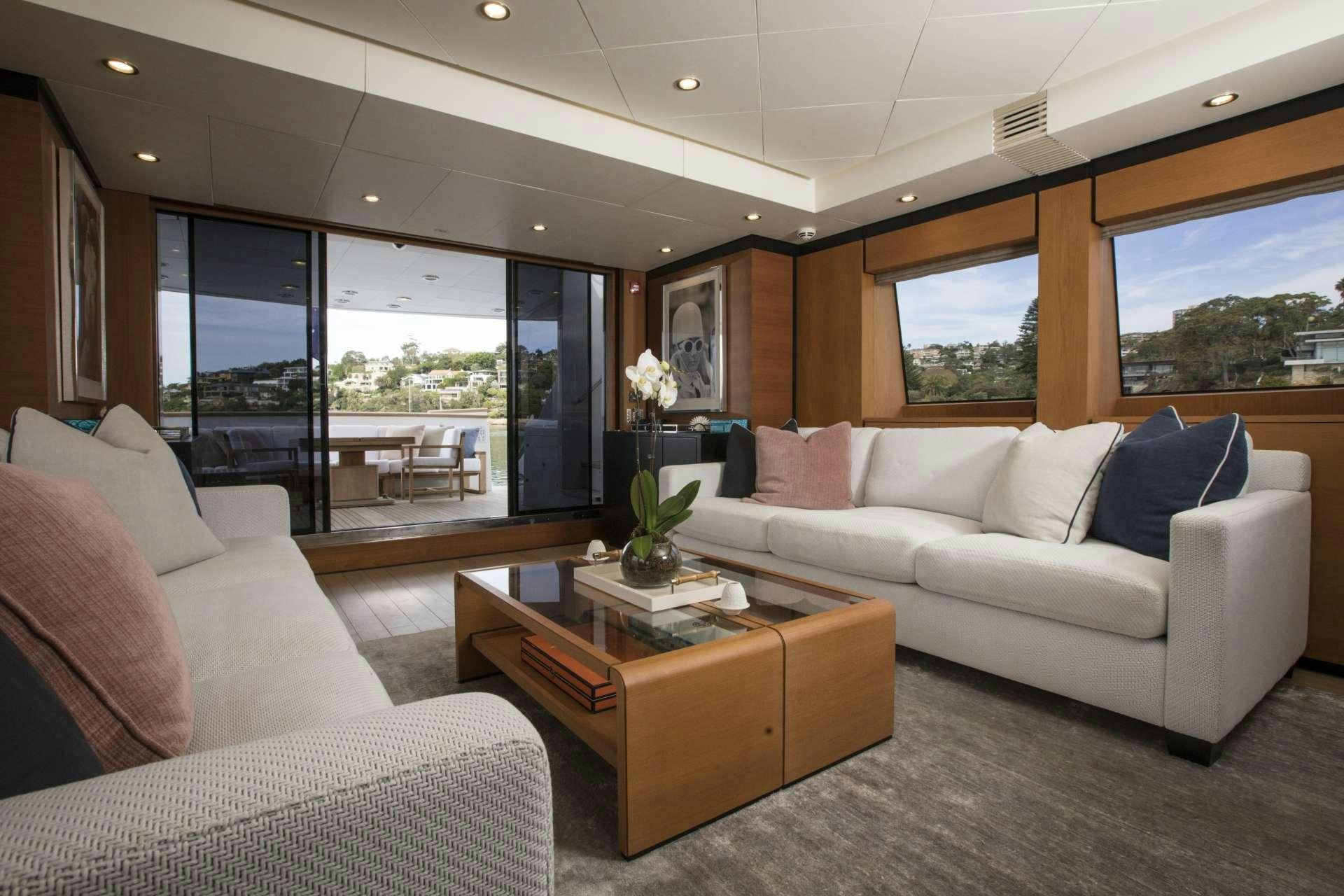 a living room with a couch and a coffee table aboard MOHASUWEI Yacht for Charter