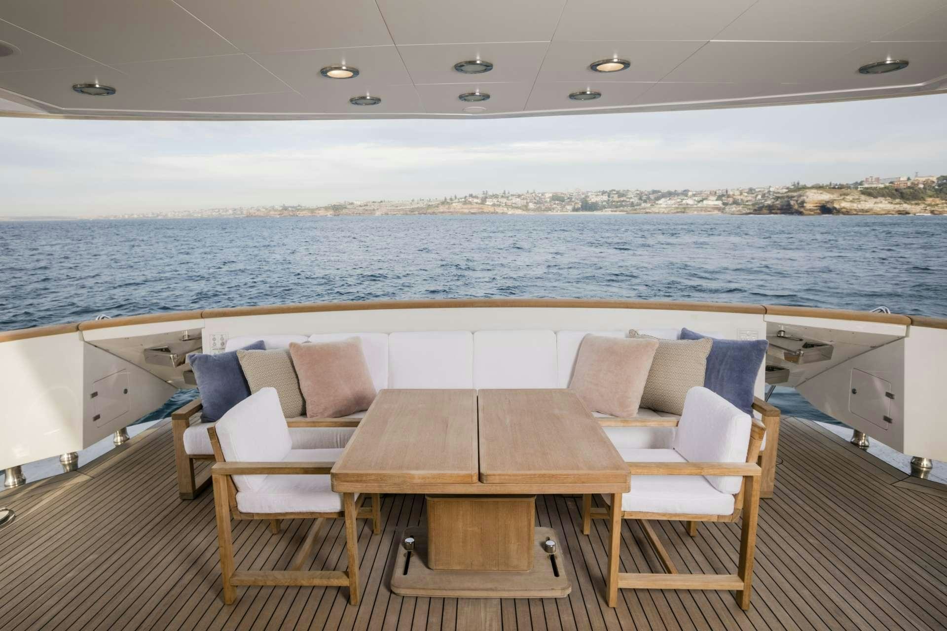 a table and chairs on a boat aboard MOHASUWEI Yacht for Charter