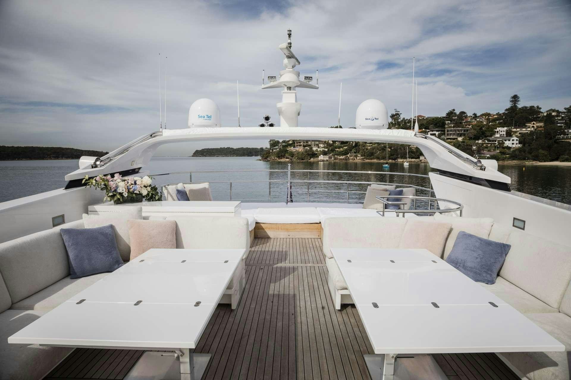 a large white boat with a white sail on it aboard MOHASUWEI Yacht for Charter
