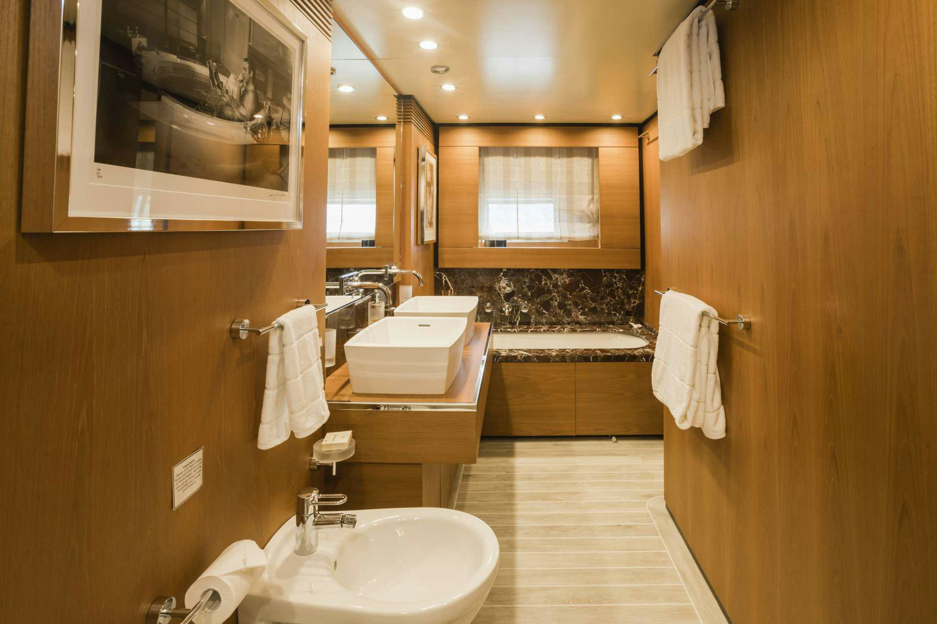a bathroom with a sink and a mirror aboard MOHASUWEI Yacht for Charter