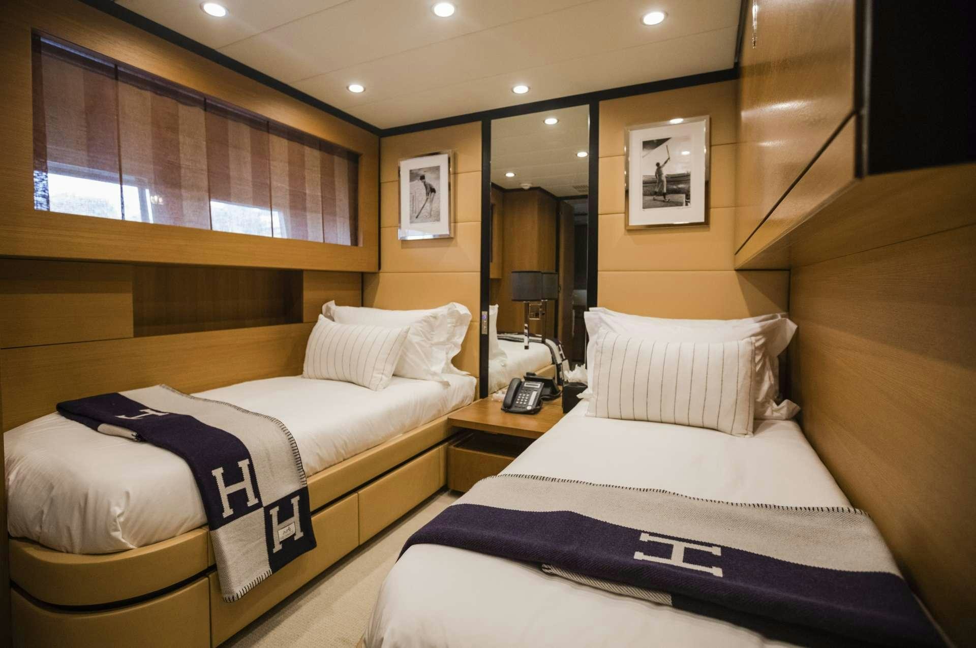 a hotel room with beds aboard MOHASUWEI Yacht for Charter