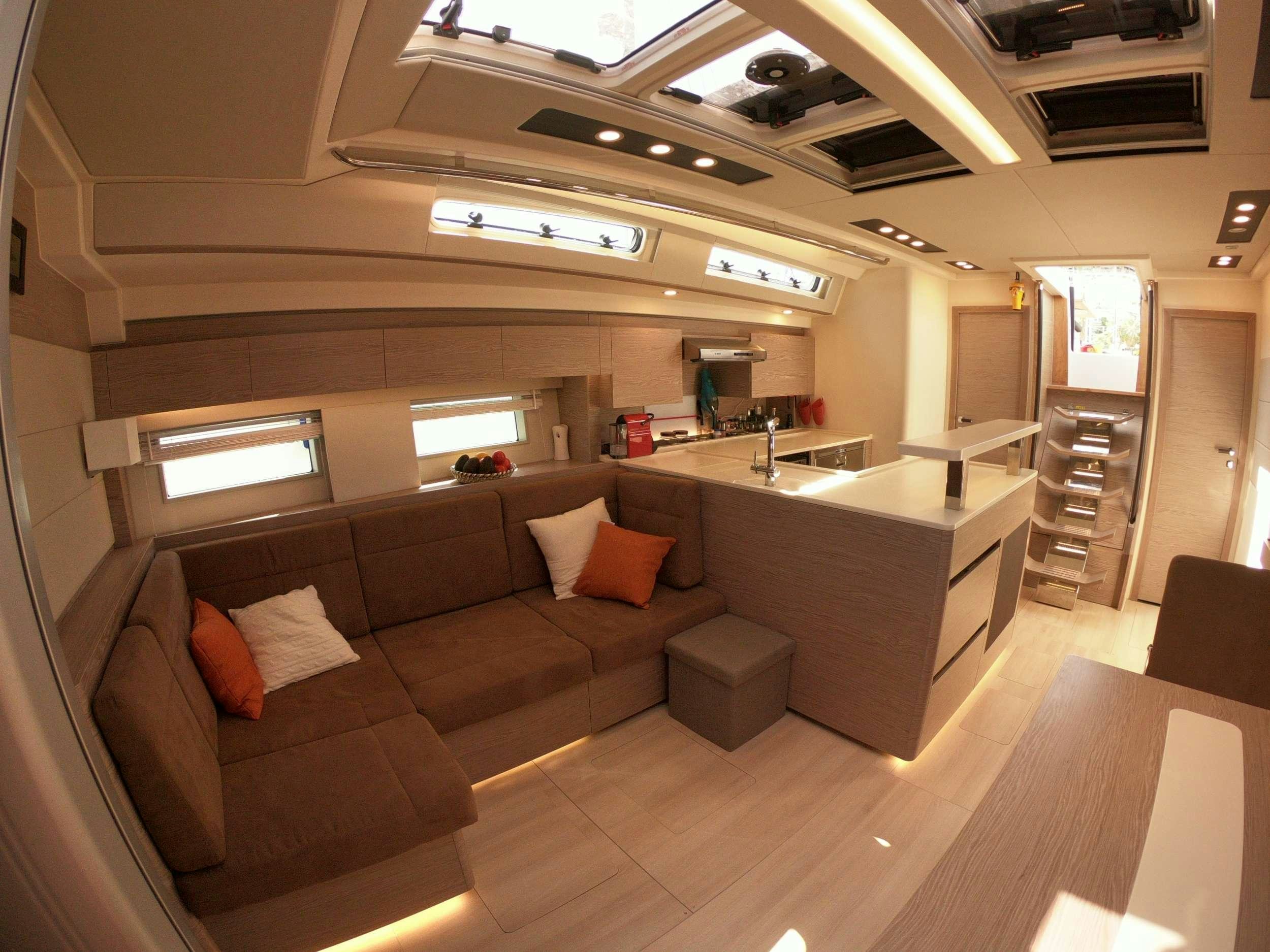 a living room with a couch and a sink aboard MED SEA TATION Yacht for Charter
