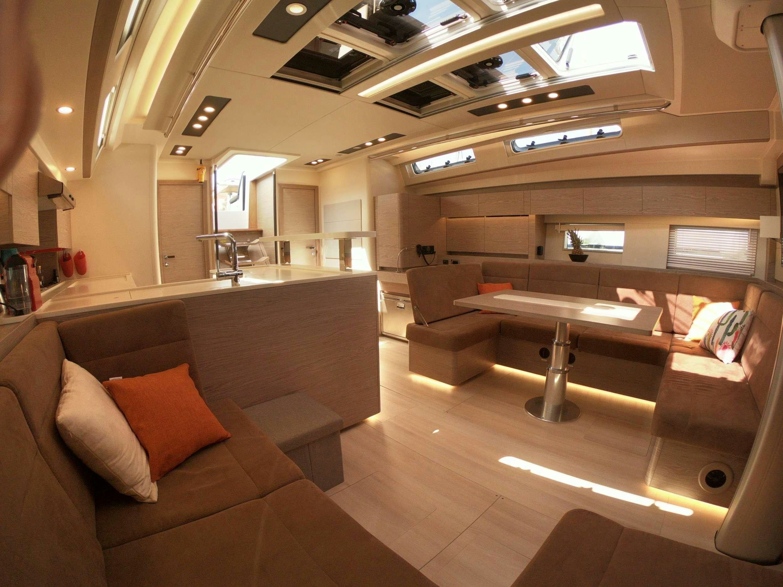 a room with a couch and a table aboard MED SEA TATION Yacht for Charter