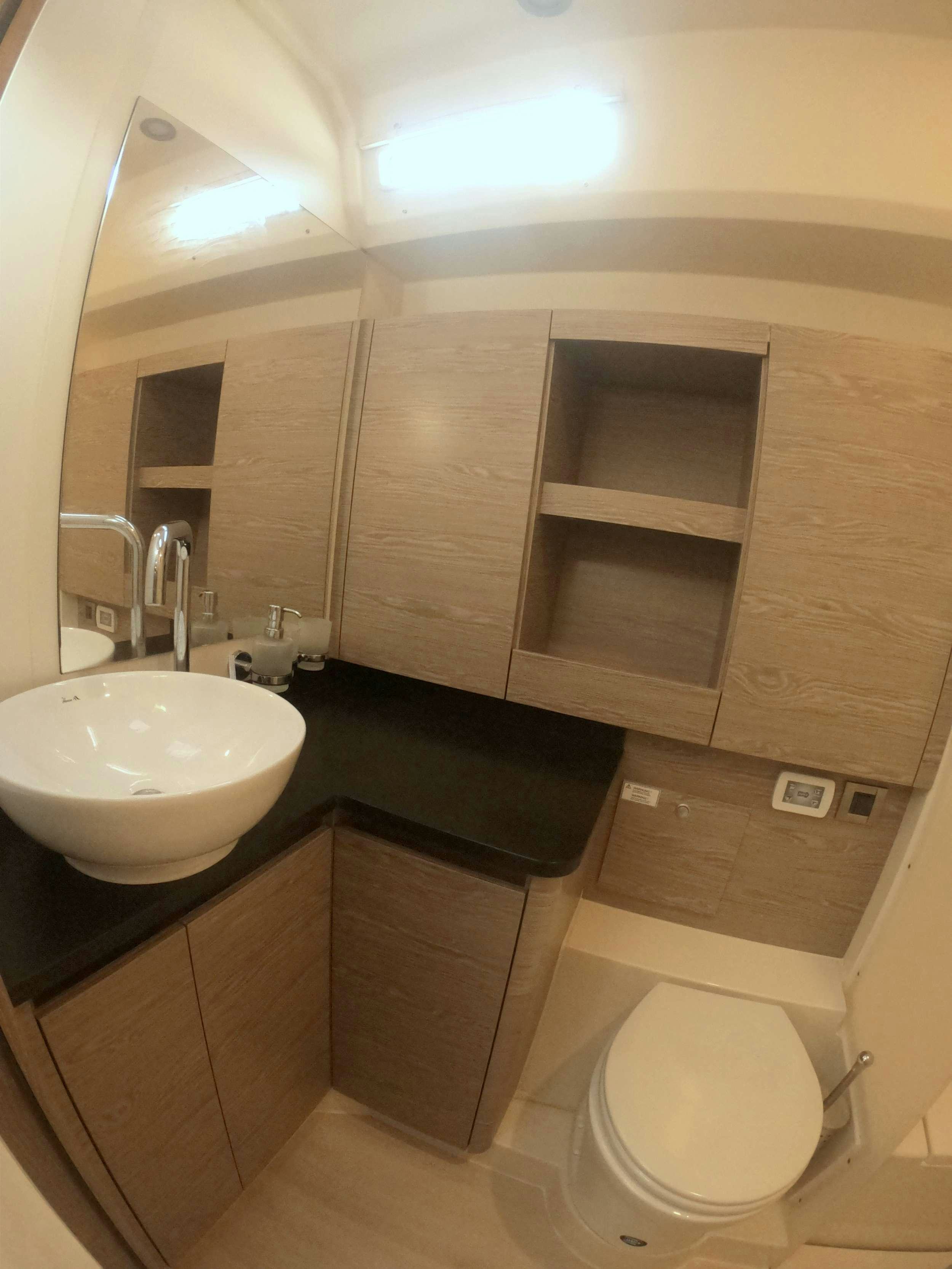 a bathroom with a sink and a toilet aboard MED SEA TATION Yacht for Charter
