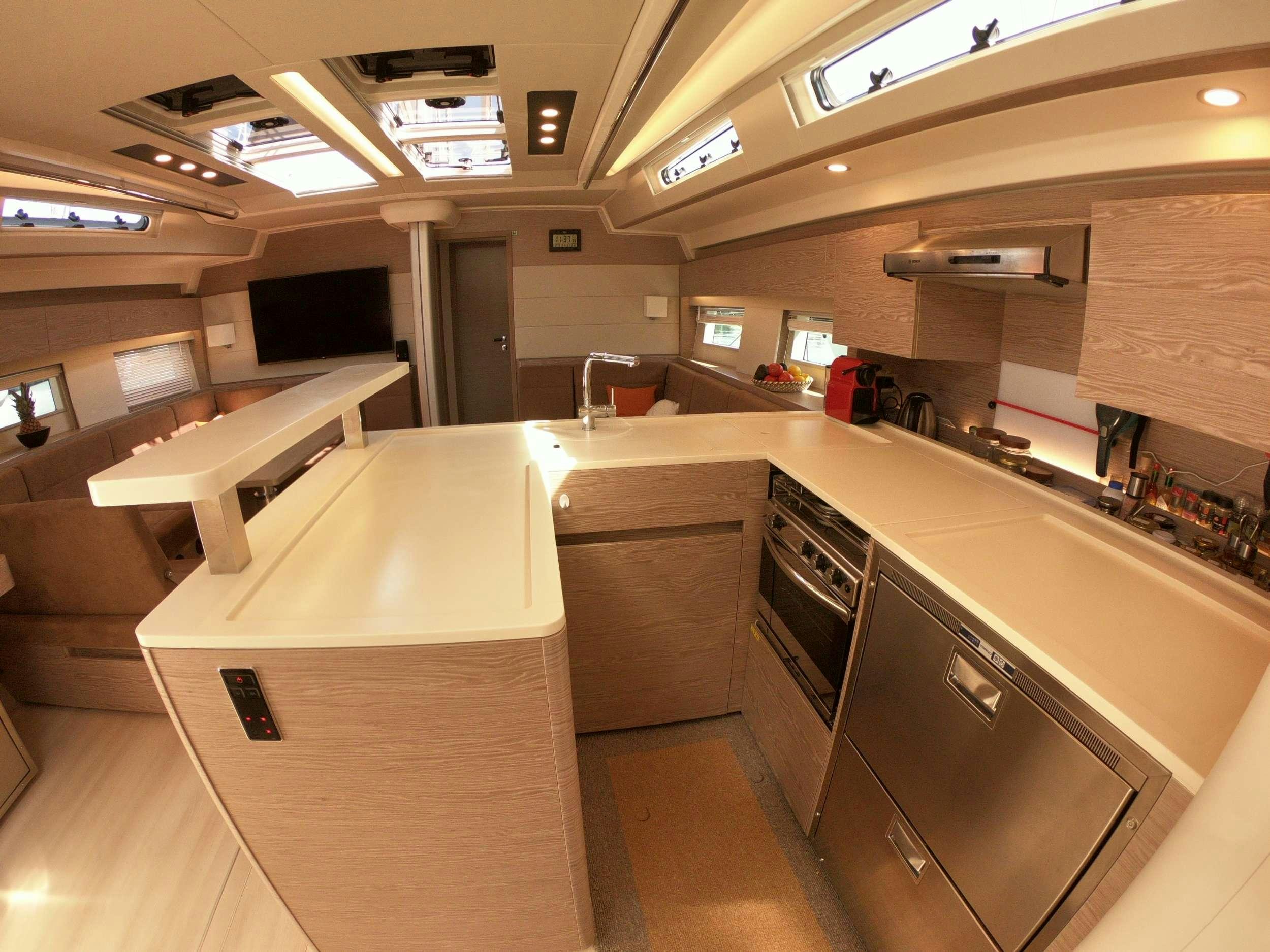 a large kitchen with a countertop aboard MED SEA TATION Yacht for Charter