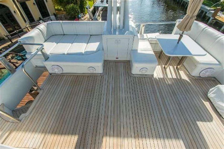 a deck with a pool and a deck with a boat and a building aboard HIGH LINE Yacht for Charter