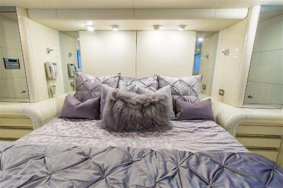 a bed with pillows aboard HIGH LINE Yacht for Charter