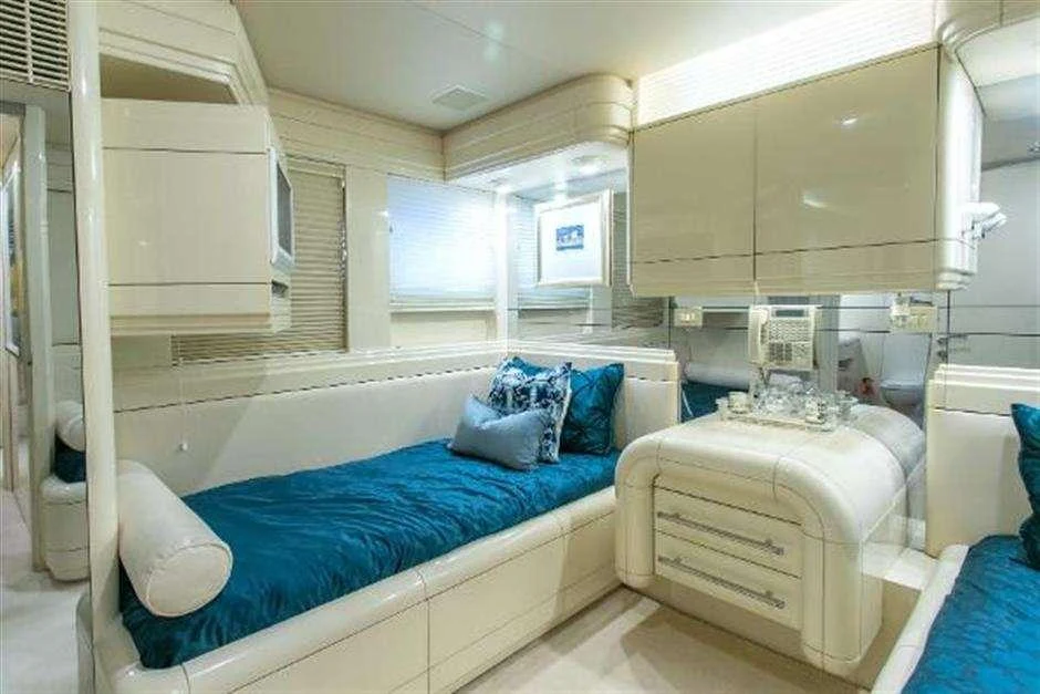 a room with a bed and a desk aboard HIGH LINE Yacht for Charter