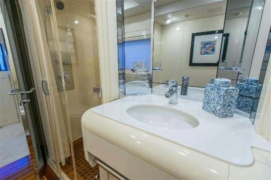 a bathroom with a sink and a mirror aboard HIGH LINE Yacht for Charter