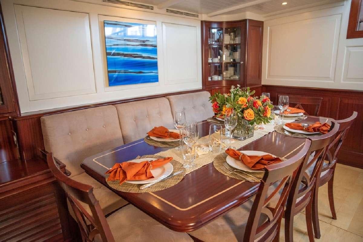 a table with food on it aboard AURELIUS 111 Yacht for Charter
