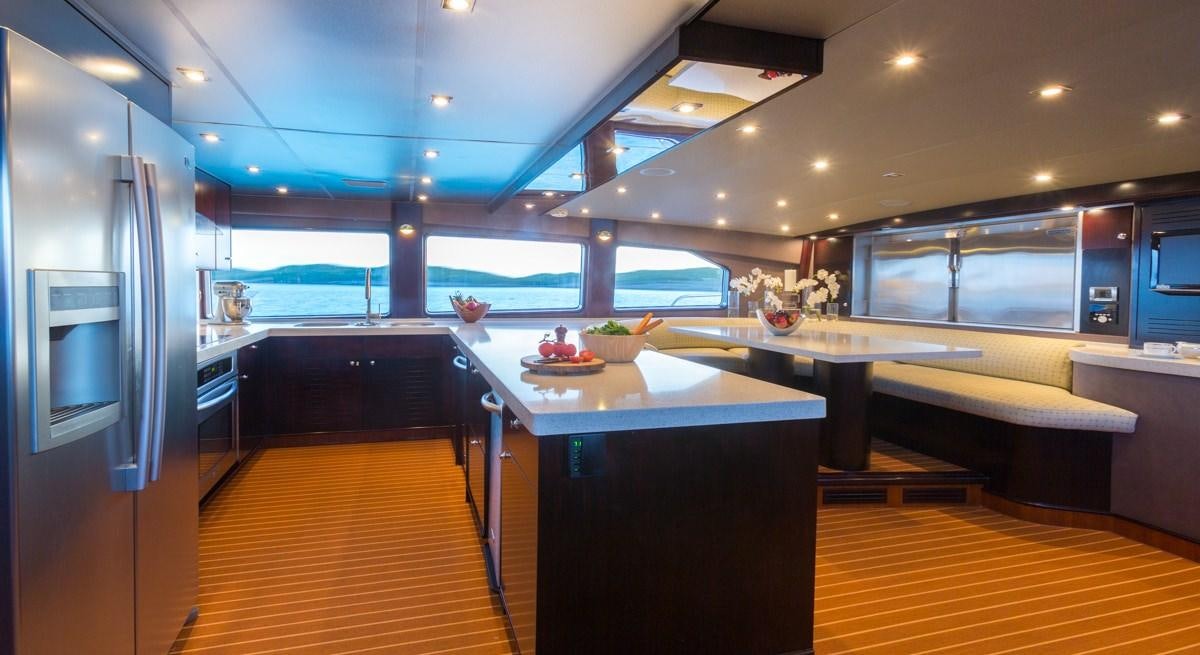 a kitchen with a large window aboard UNBRIDLED Yacht for Charter