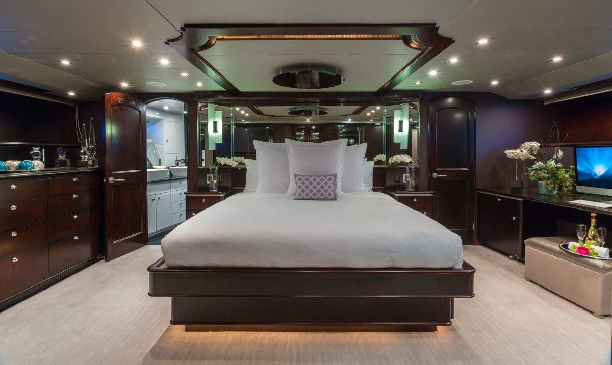 a large bed in a room aboard UNBRIDLED Yacht for Charter