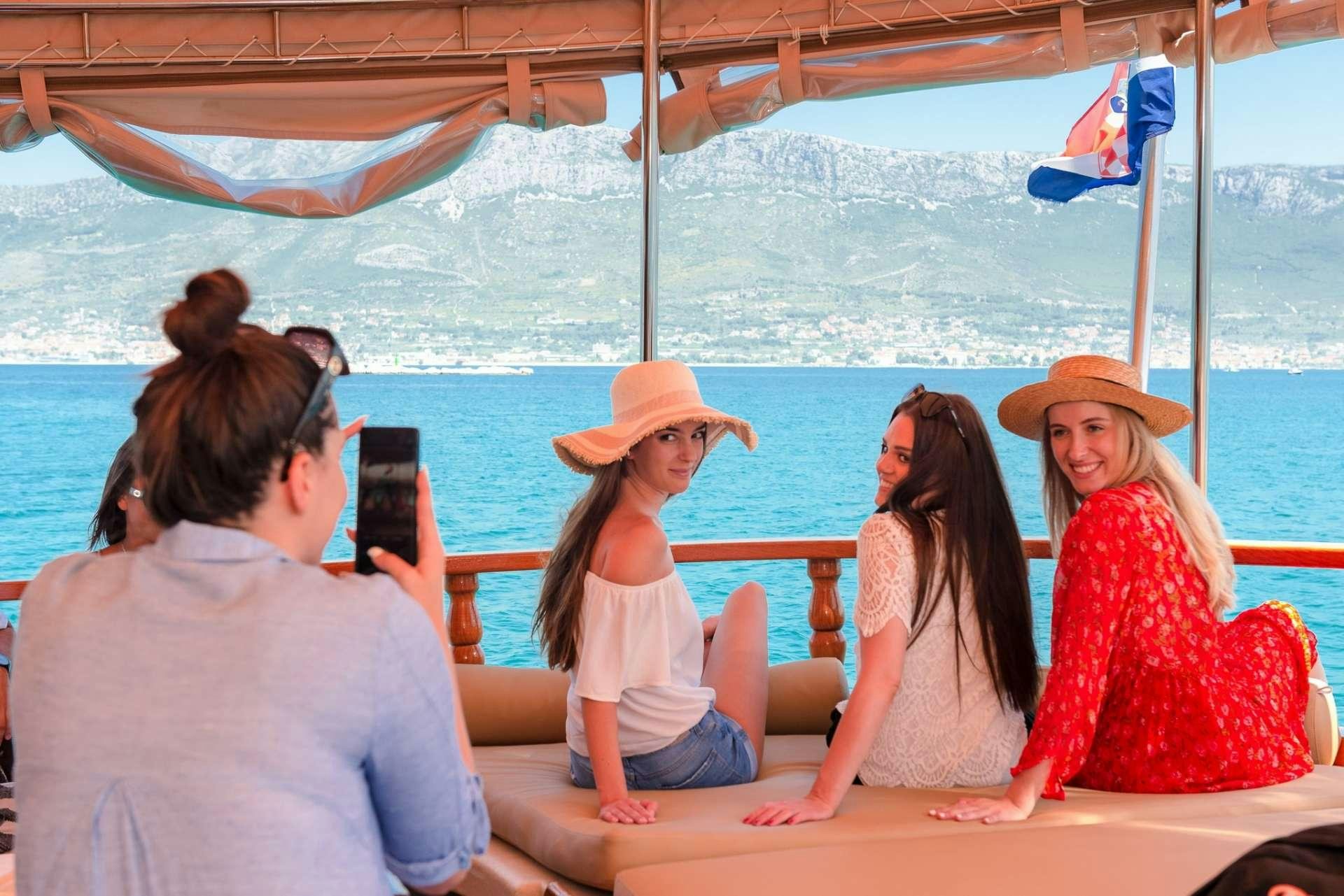 a group of women sitting on a boat aboard Dona Yacht for Charter