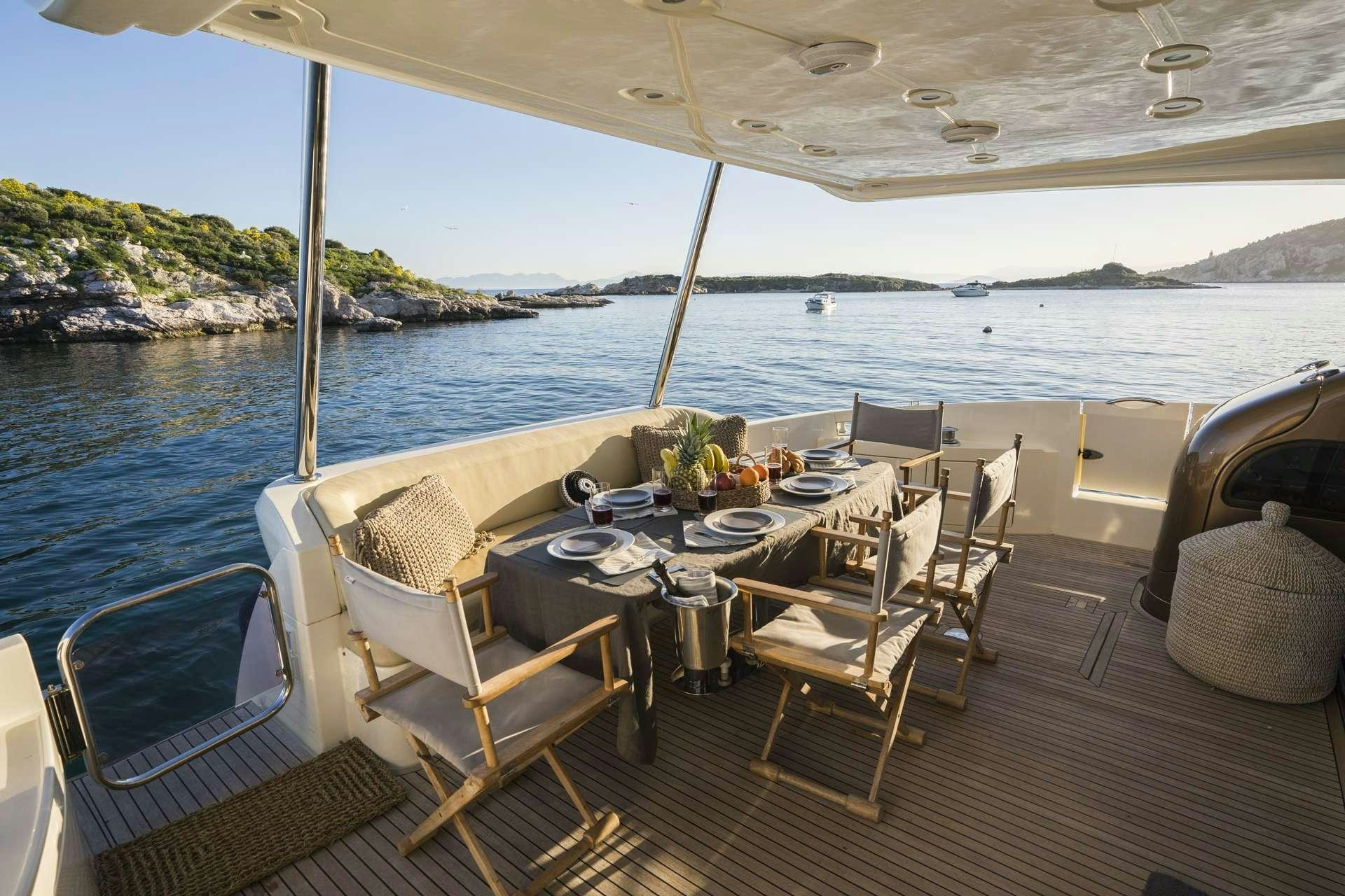 a table set for a meal on a boat aboard MEDUSA Yacht for Charter