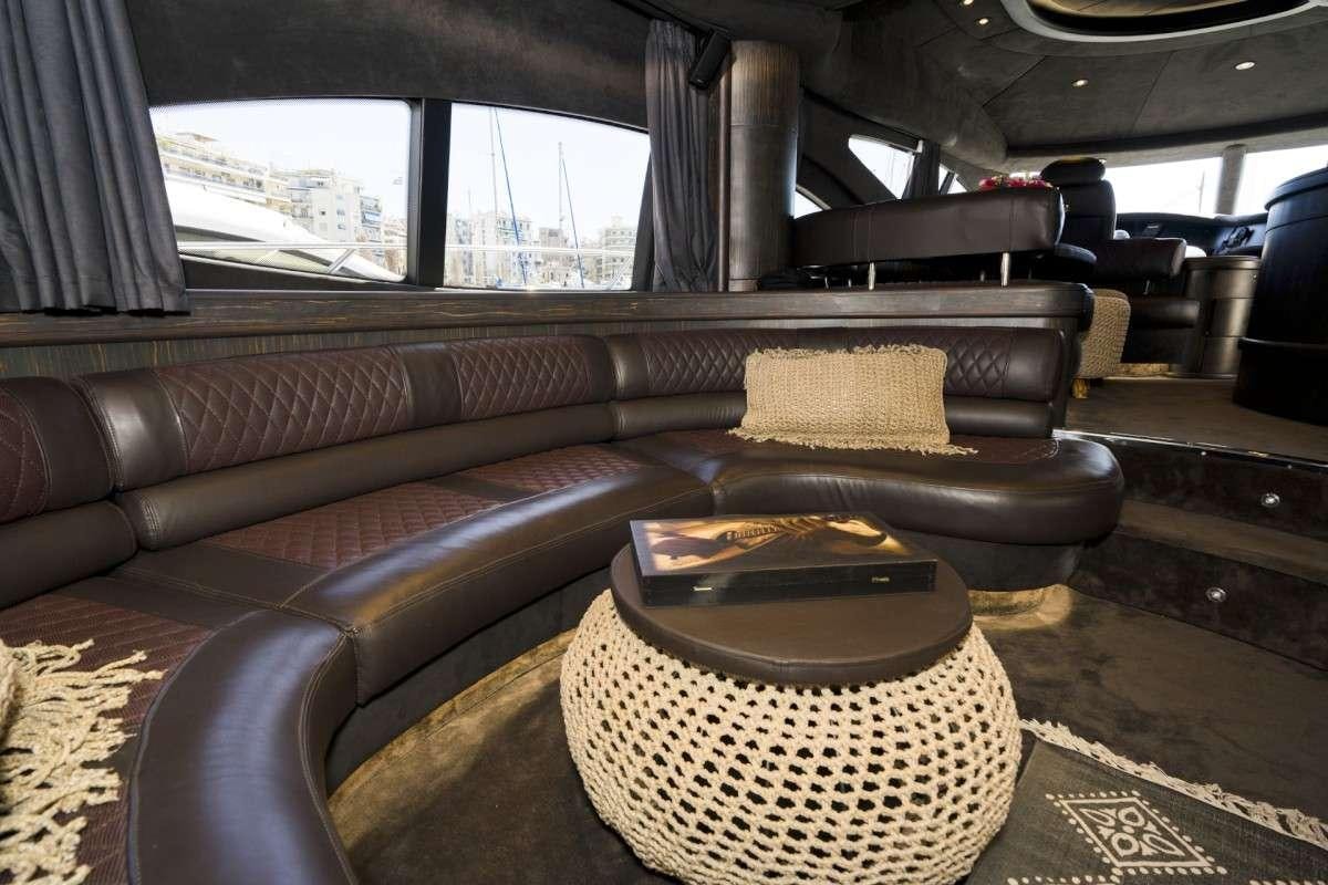 a leather couch in a room aboard MEDUSA Yacht for Charter