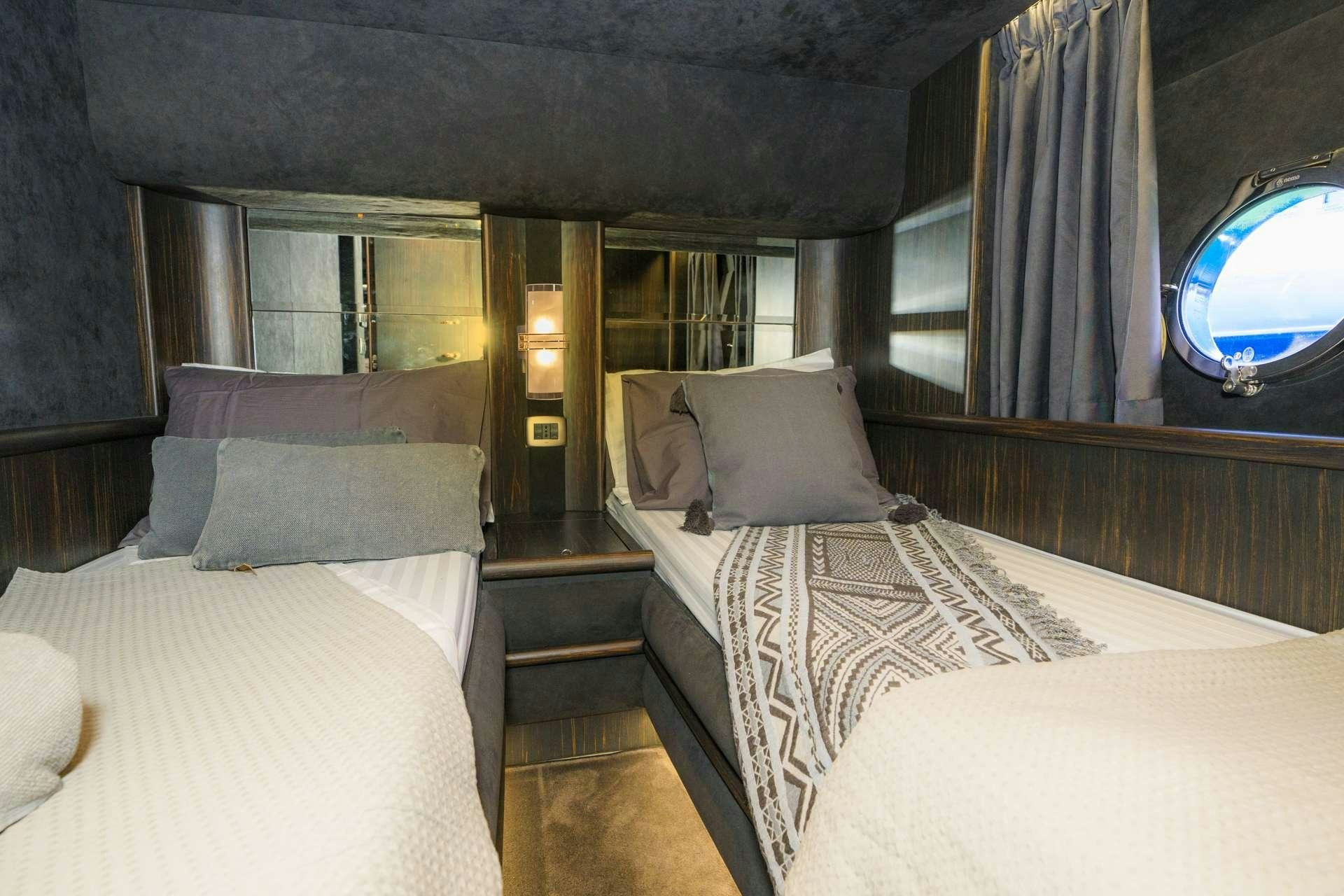 a room with two beds aboard MEDUSA Yacht for Charter