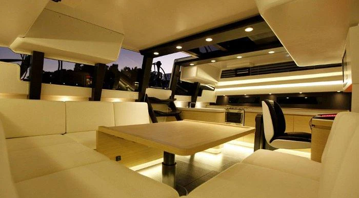 an airplane with desks and chairs aboard SHAMLOR Yacht for Charter