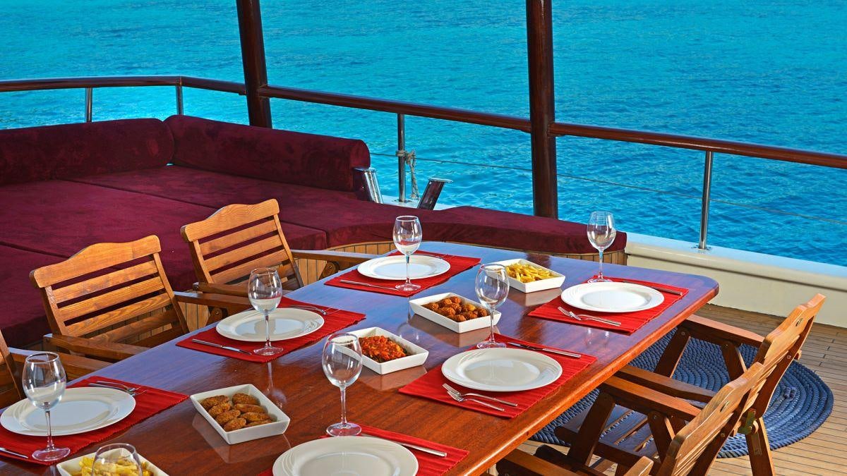 a table with food on it aboard LOVE BOAT Yacht for Charter
