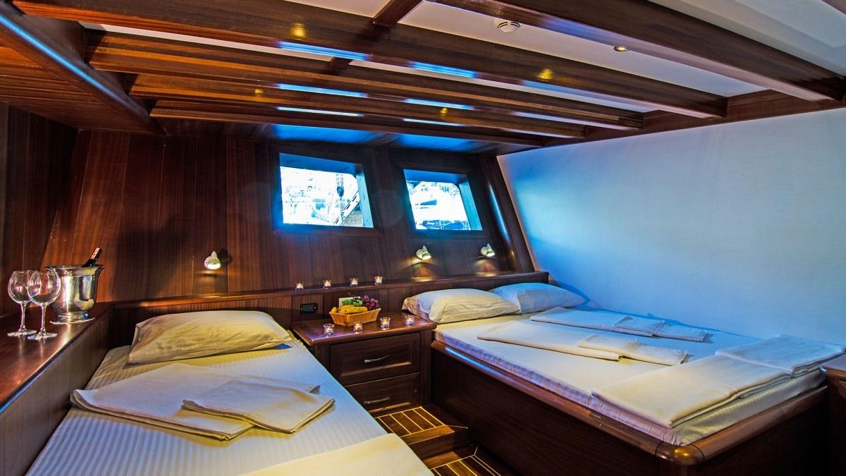 a room with two beds aboard LOVE BOAT Yacht for Charter