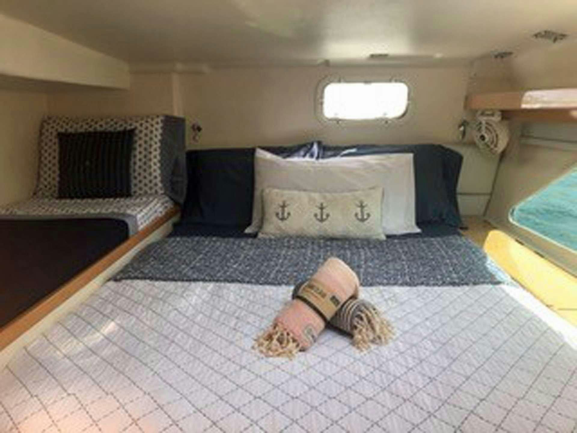 a stuffed toy on a bed aboard GUINEVERE Yacht for Charter
