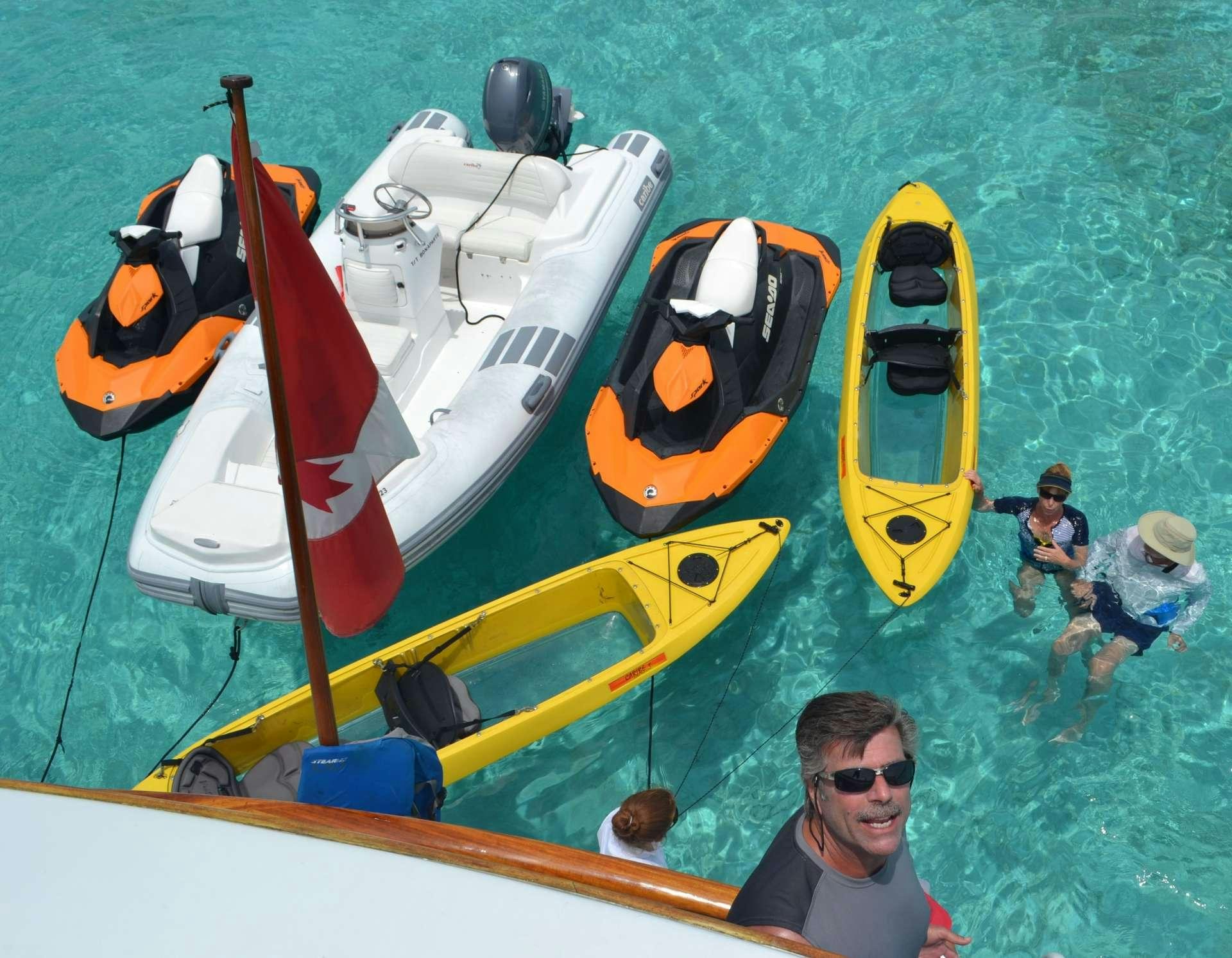 a person sitting in a yellow boat aboard BONAPARTE Yacht for Charter