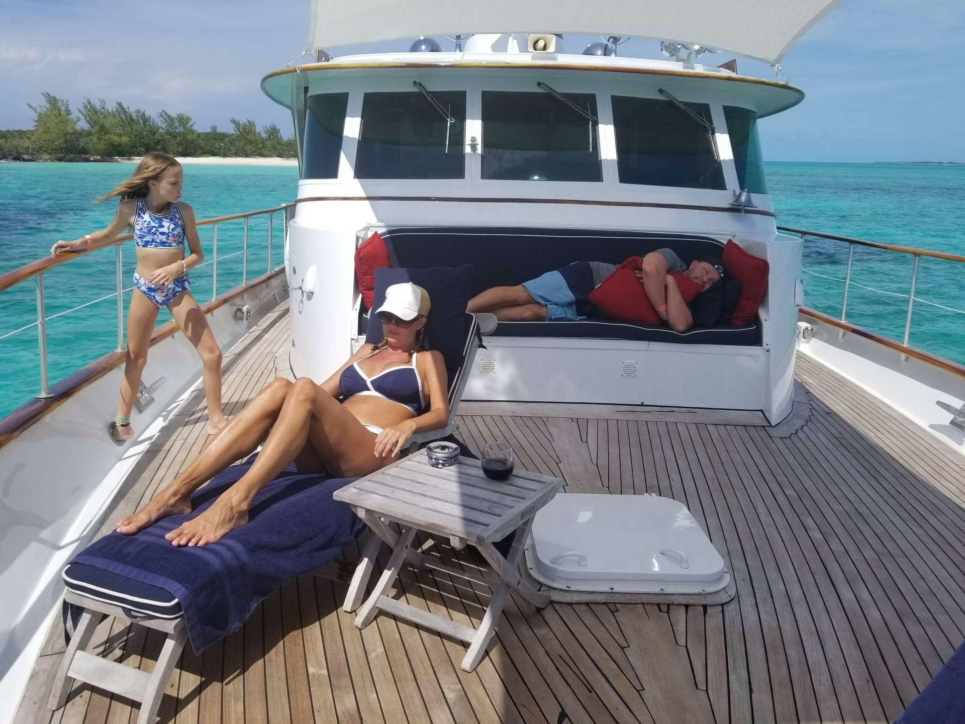a couple of women sitting on a boat on the water aboard BONAPARTE Yacht for Charter