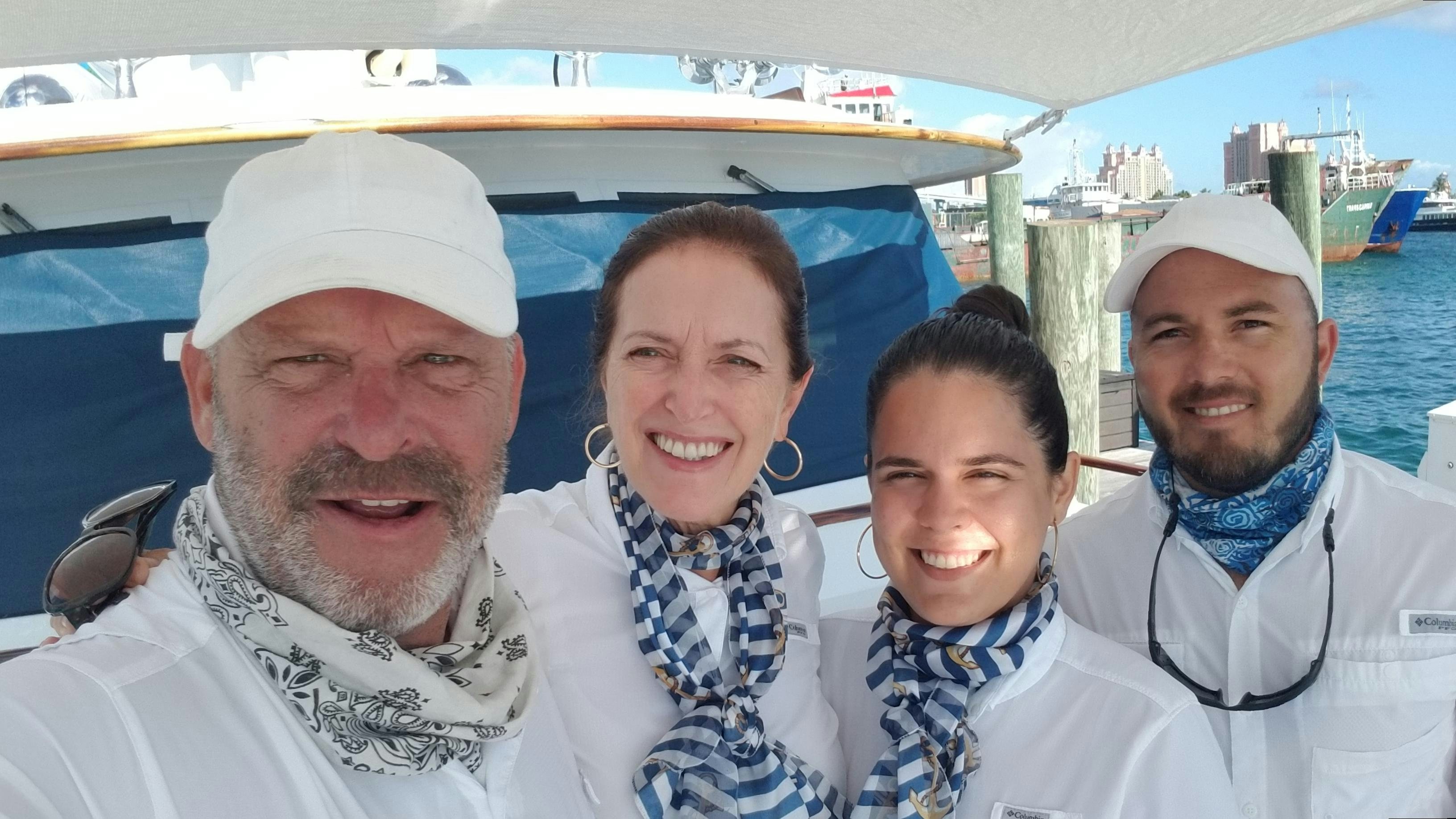 a group of people posing for a photo aboard BONAPARTE Yacht for Charter