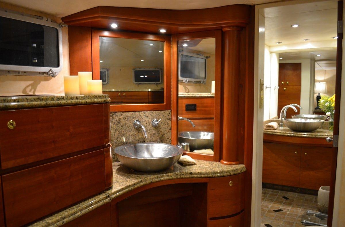 a kitchen with wooden cabinets aboard BONAPARTE Yacht for Charter