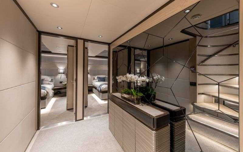 a room with a table and chairs aboard ONEWORLD Yacht for Charter