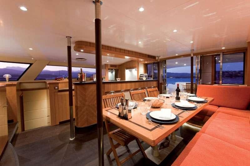 a dining room with a table and chairs aboard MOBY DICK Yacht for Charter