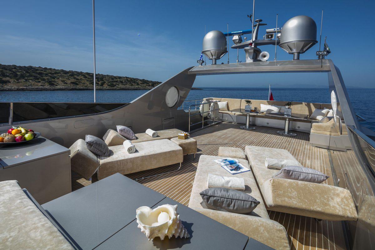 a deck with a large boat and a large metal object on it aboard XANAX Yacht for Charter