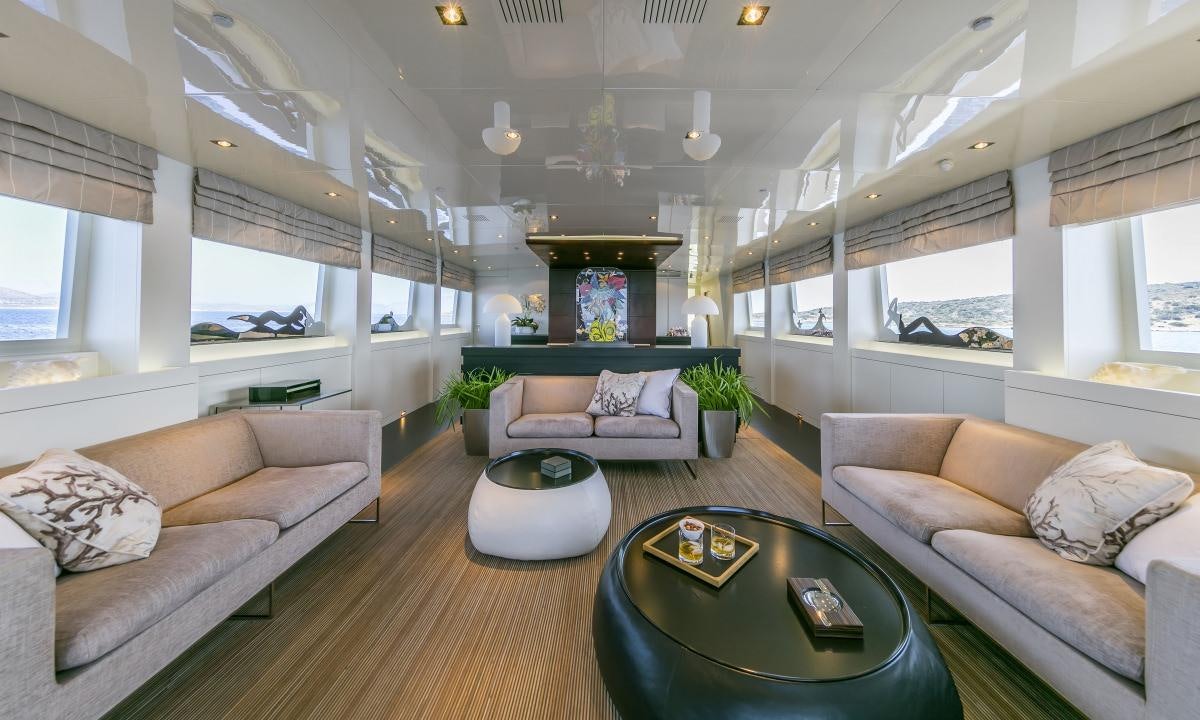 a living room with a fireplace aboard XANAX Yacht for Charter