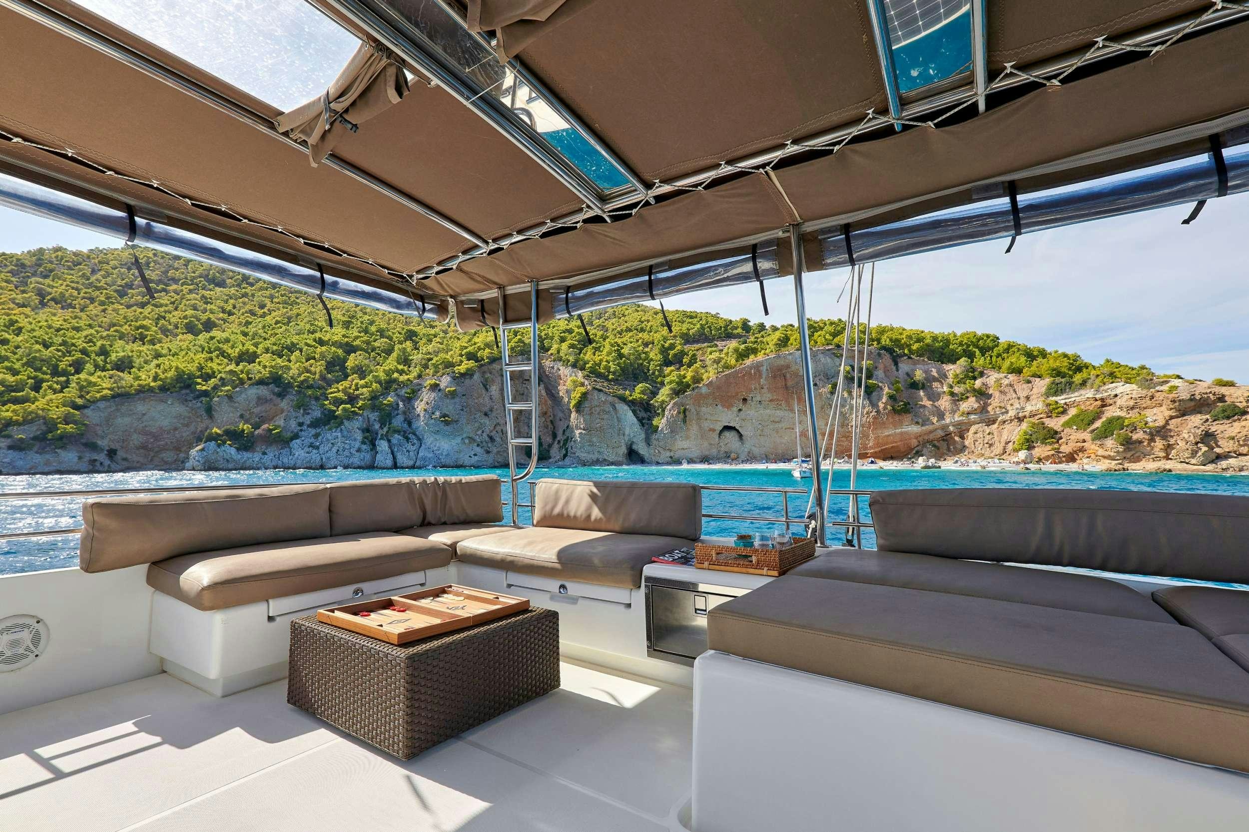 a room with a view of a city and a large body of water aboard GOLDEN PEARL Yacht for Charter