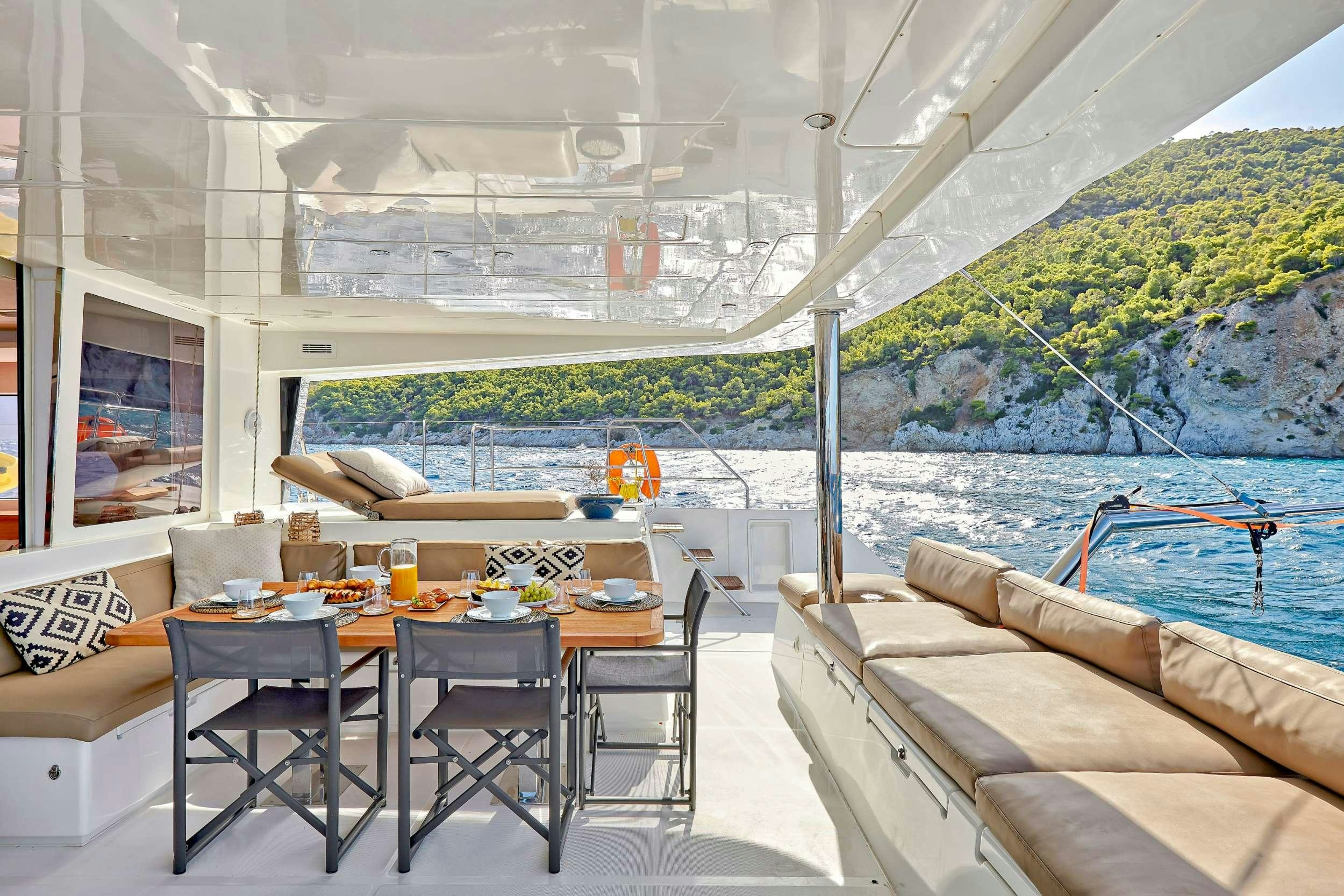 a table and chairs on a boat aboard GOLDEN PEARL Yacht for Charter