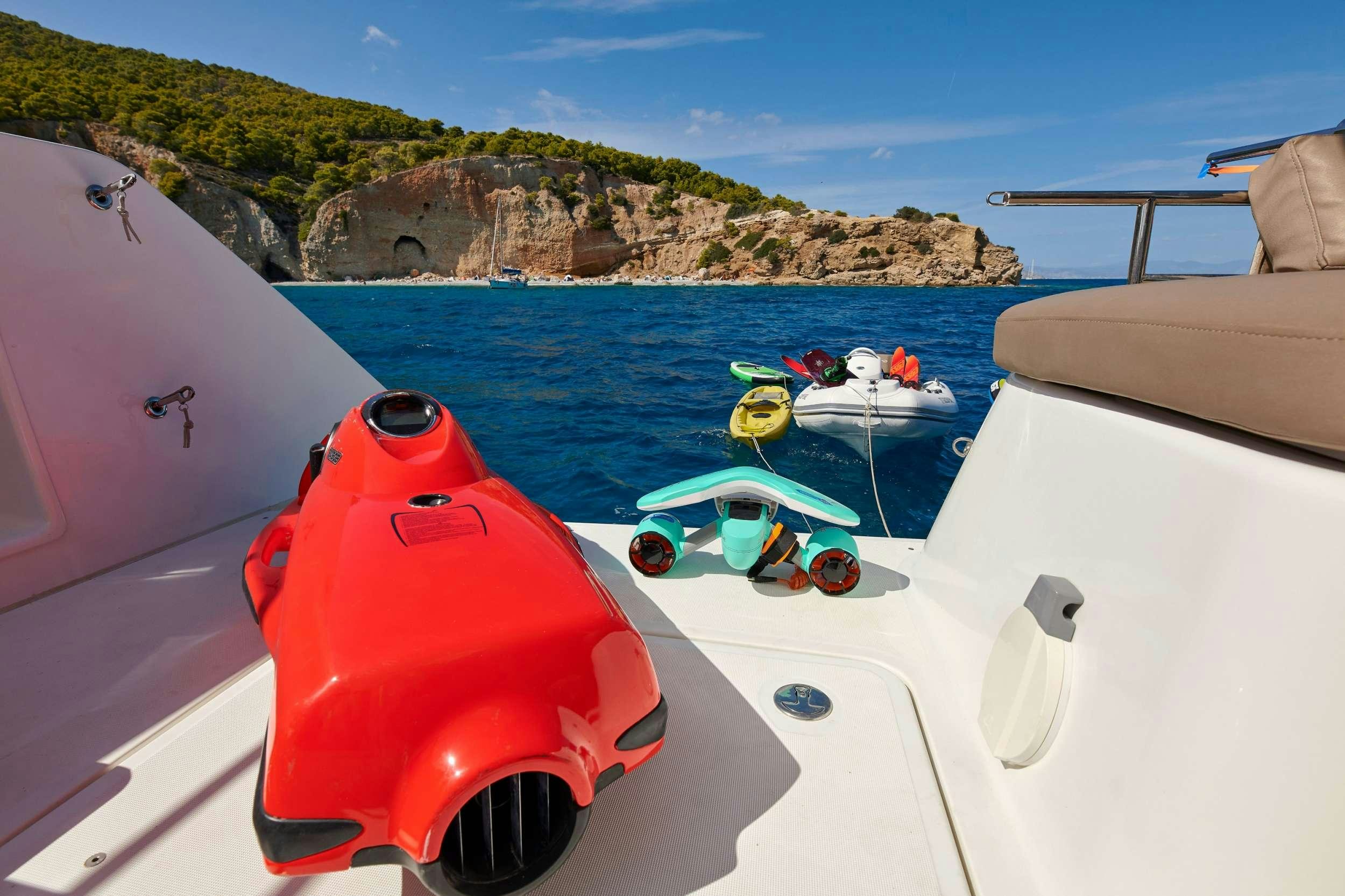 a group of boats on a body of water aboard GOLDEN PEARL Yacht for Charter