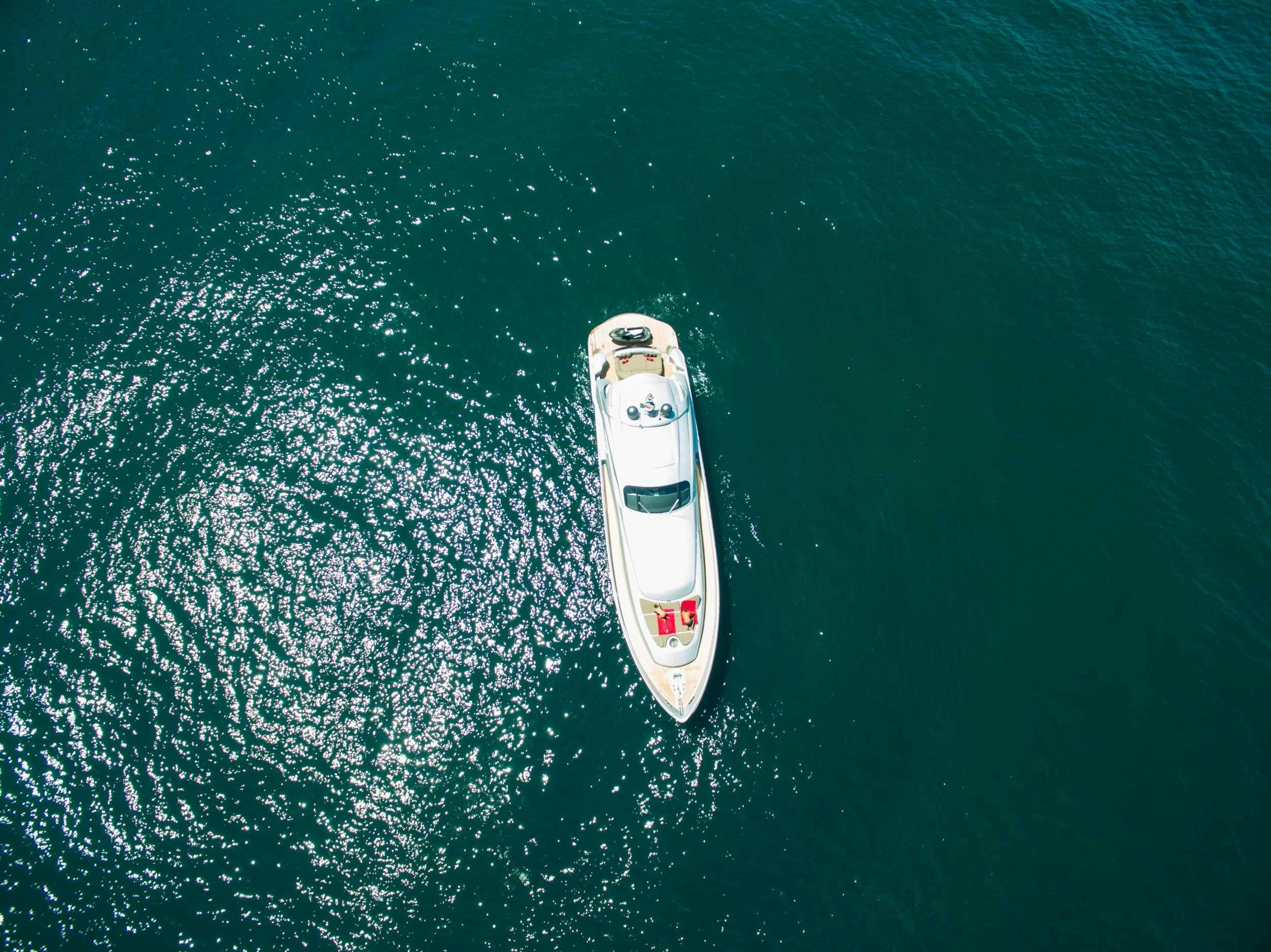 a white boat in the water aboard CINQUE Yacht for Charter