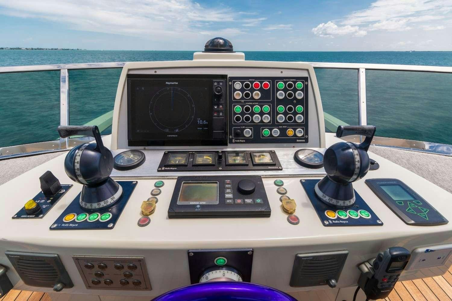 a video game console and controller aboard Scarlet Yacht for Charter