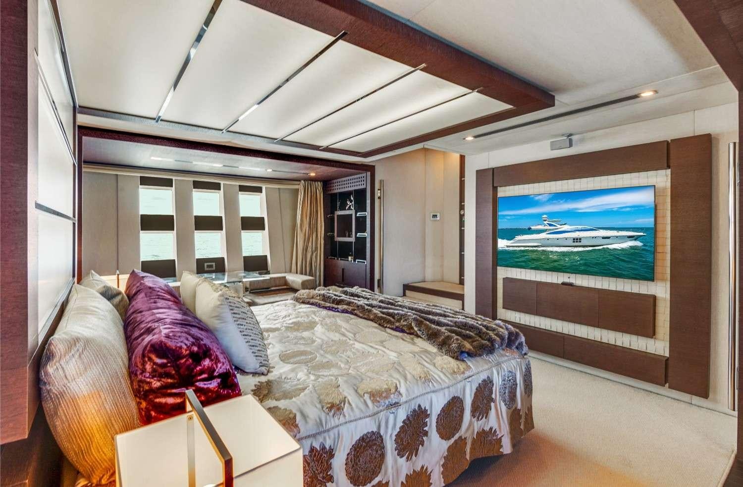 a bedroom with a large bed aboard Scarlet Yacht for Charter