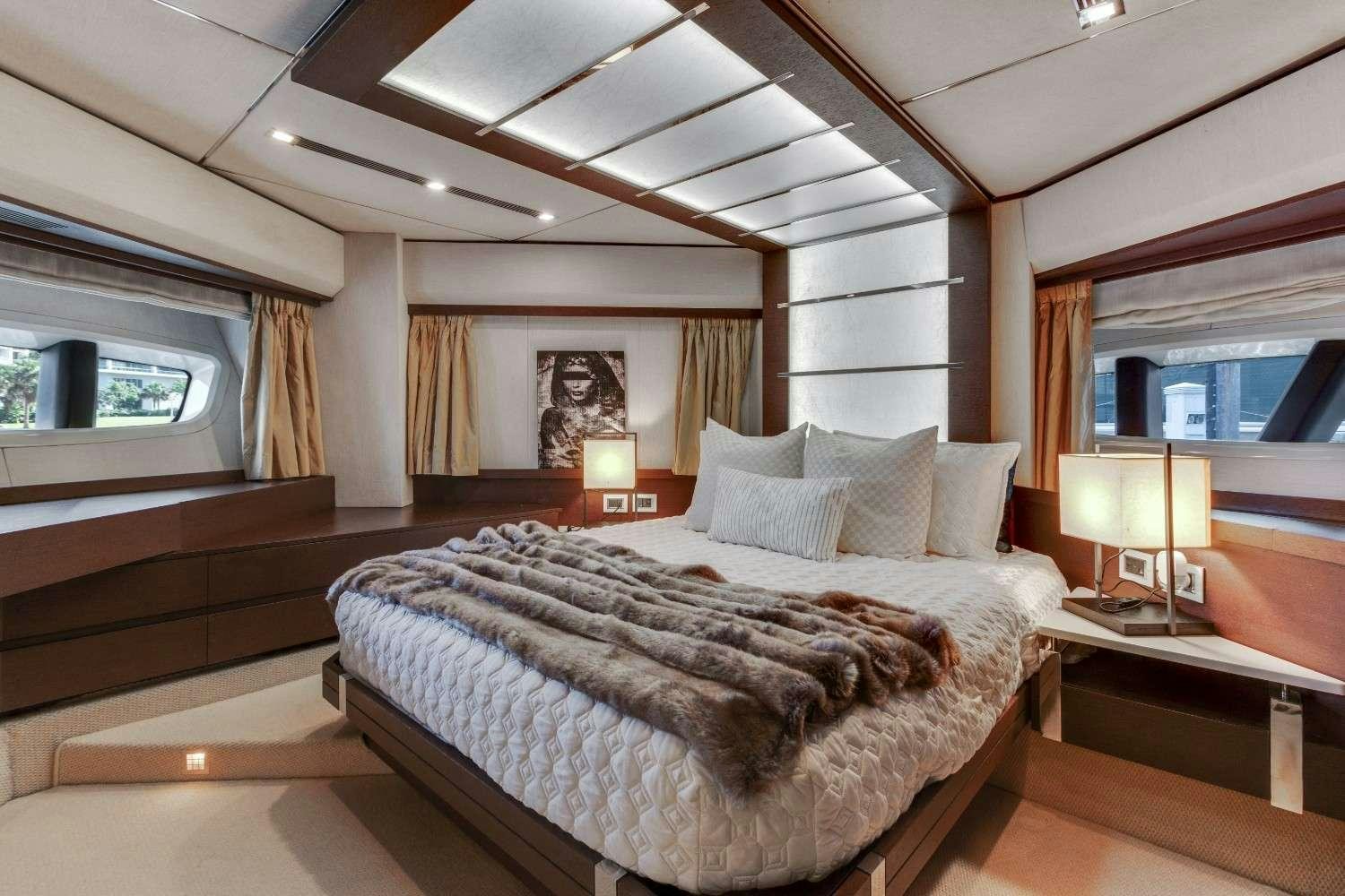 a bedroom with a large bed aboard Scarlet Yacht for Charter