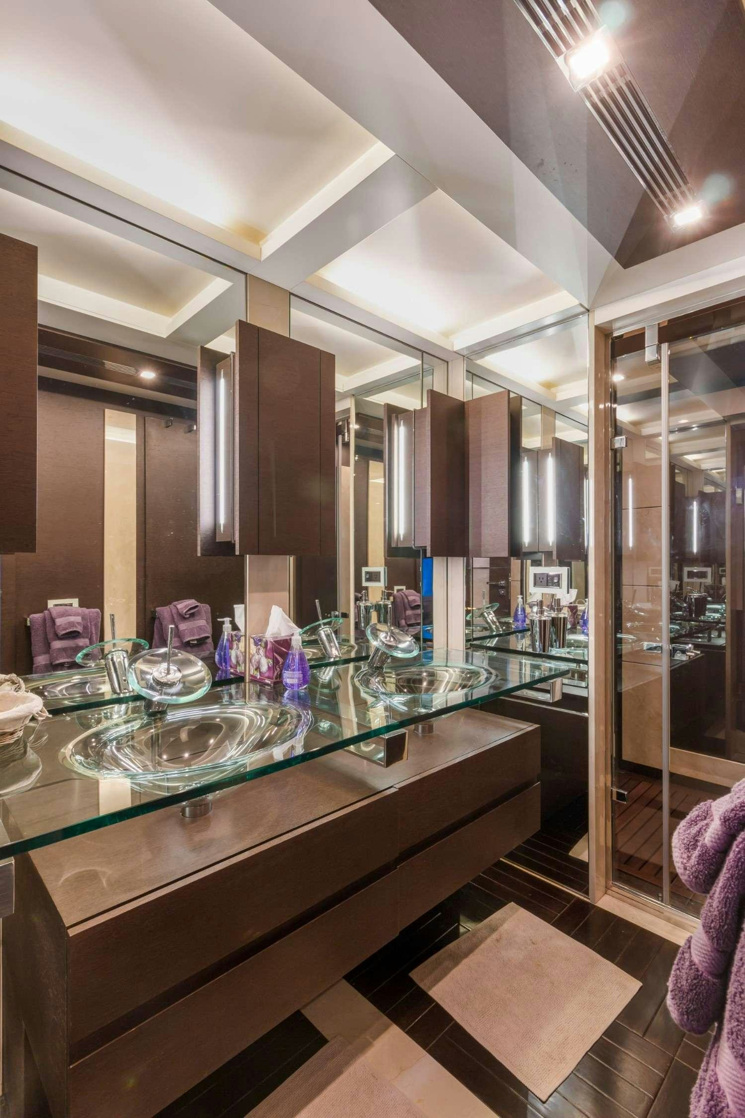 a large kitchen with a glass display aboard Scarlet Yacht for Charter