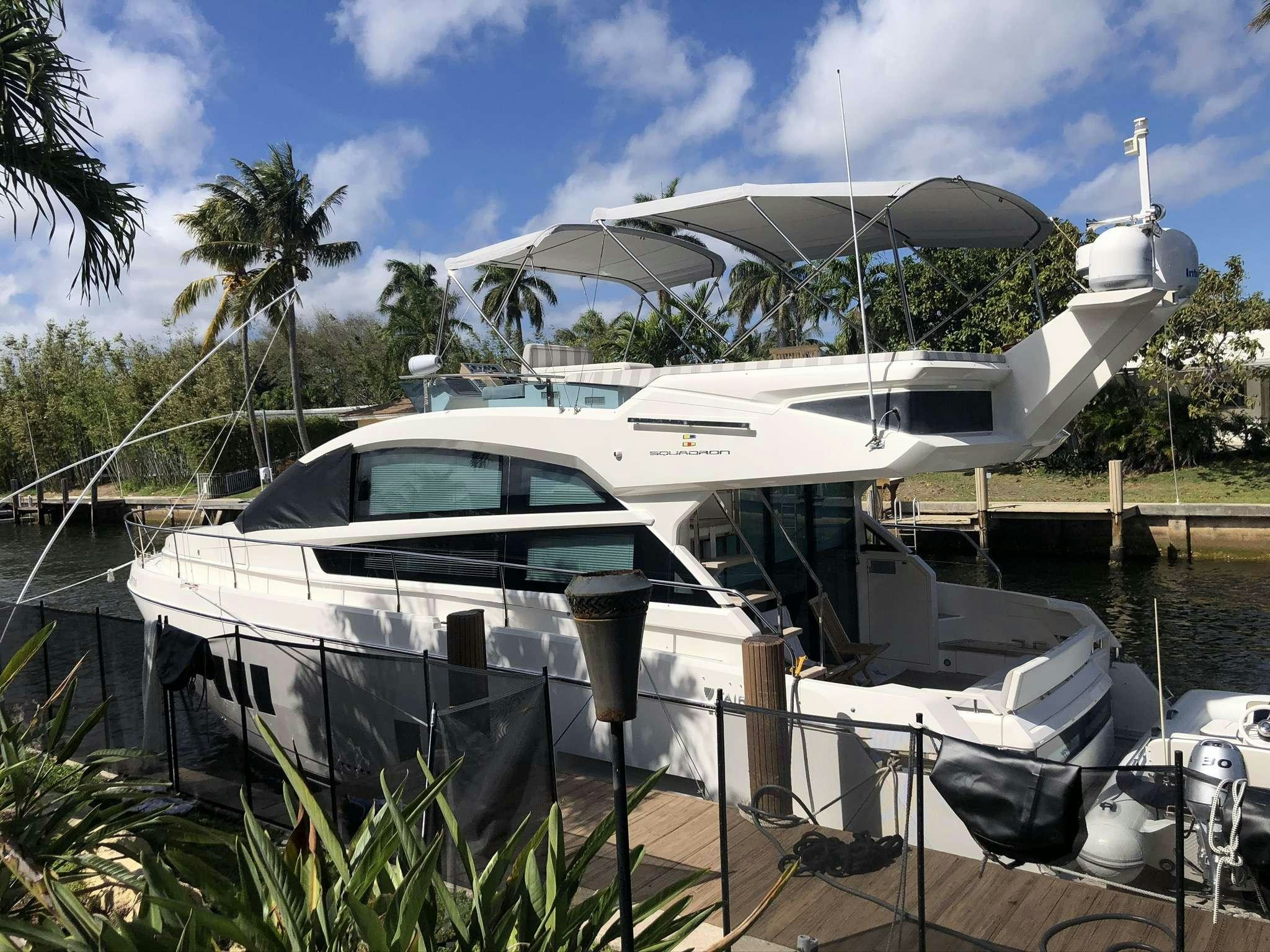 a boat docked at a pier aboard Synergy Yacht for Charter
