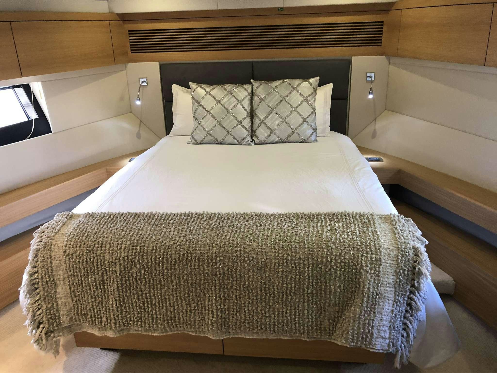 a bed in a room aboard Synergy Yacht for Charter